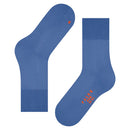Paar Falke Run Sock 16605 sportsokken voor dames en heren in roestbruin, met geribde boorden en blauwe logodetails. - Jambelles