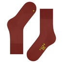 Paar Falke Run Sock 16605 sportsokken voor dames en heren in roestbruin, met geribde boorden en blauwe logodetails. - Jambelles
