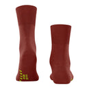 Paar Falke Run Sock 16605 sportsokken voor dames en heren in roestbruin, met geribde boorden en blauwe logodetails. - Jambelles