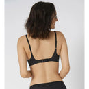 Damesmodel van achteren in zwarte sloggi BODY ADAPT bralette met brede bandjes, gladde stof en diepe ronde rug. - Jambelles