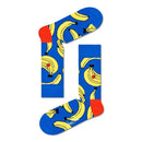Groene Happy Socks Banana BAN01 fantasiesokken voor dames en heren met gele bananen, gedragen met kleurrijke sneakers. - Jambelles