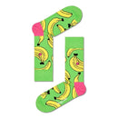 Groene Happy Socks Banana BAN01 fantasiesokken voor dames en heren met gele bananen, gedragen met kleurrijke sneakers. - Jambelles