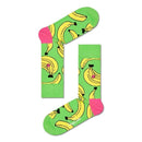 Groene Happy Socks Banana BAN01 fantasiesokken voor dames en heren met gele bananen, gedragen met kleurrijke sneakers. - Jambelles