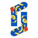 Groene Happy Socks Banana BAN01 fantasiesokken voor dames en heren met gele bananen, gedragen met kleurrijke sneakers. - Jambelles