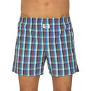 Deal herenboxer in turquoise en blauw met rood ruitdessin en elastische tailleband, zijaanzicht op model. - Jambelles