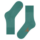 Paar Falke Run Sock 16605 sportsokken voor dames en heren in roestbruin, met geribde boorden en blauwe logodetails. - Jambelles