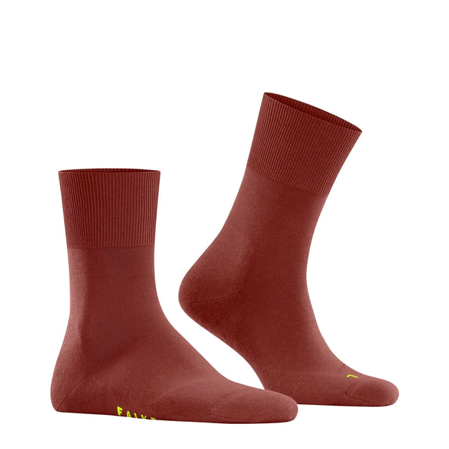 Falke Run Sock 16605 dames- en herensportsokken in roestbruin met geribde boord en neongele logodetails. - Jambelles