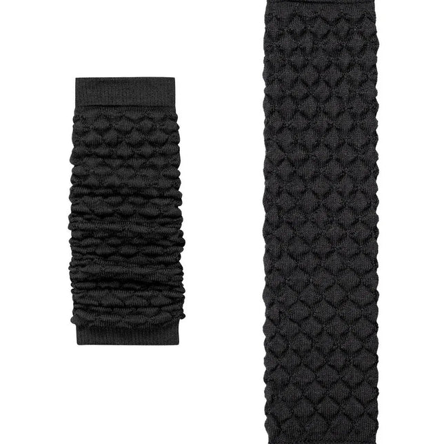 Falke dameslegwarmers Arctic Haze 46607 in donkergrijs met gebreid ruitpatroon, geplooid en uitgestrekt afgebeeld. - Jambelles