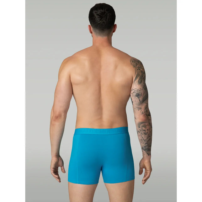 Muchachomalo herenboxer Lcsolid1010 in effen turquoise, achteraanzicht met elastische logoband en korte pijpen. - Jambelles