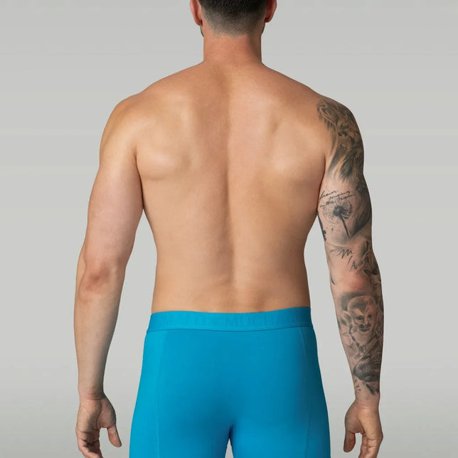 Muchachomalo herenboxer Lcsolid1010 in effen turquoise, achteraan gedragen, met brede elastische logotailleband. - Jambelles