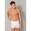 Schiesser herenboxershort 174004 in grijs gemêleerd, achteraanzicht met korte pijpen en dunne zwarte tailleband. - Jambelles
