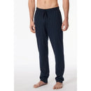 Schiesser Heren Broek Lang 182185 in grijs met donkerblauw ruitdessin en strikkoord, gedragen door een model. - Jambelles
