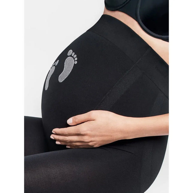 Zwarte Wolford Maternity Treasure 66 dameslegging met hoge buikband en zilverkleurige babyvoetafdrukken. - Jambelles