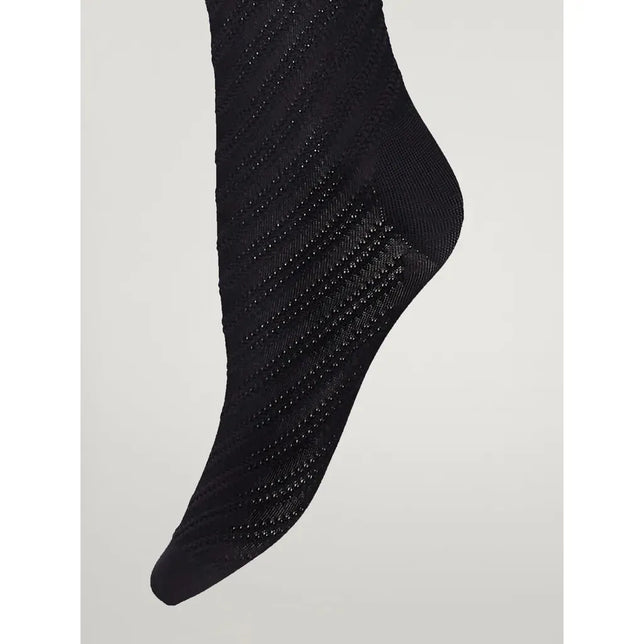 Wolford 3D Geometric Tights 14939, zwarte damespanty met glanzend geometrisch patroon op been en voet. - Jambelles
